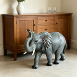 20-Inch Tall Resin Elephant Statue with Raised Trunk, Grey